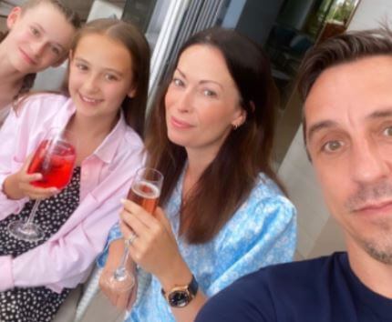 Emma Hadfield with her husband Gary Neville and daughters Molly and Sophie in Ibiza.